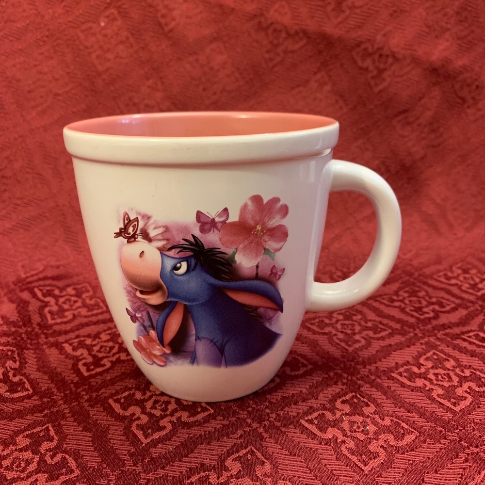 Disney Store pink Eeyore butterfly and flower coffee cup.